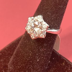 Moissanite 3.05 ctw.  Platinum over Sterling. Center stone approximately 3 ct